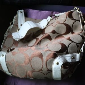 Coach tan with white trim.